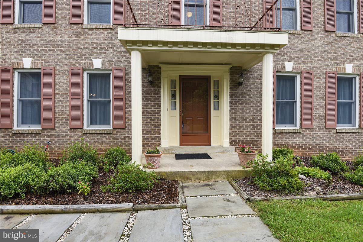 2313 Holly Spring Drive Silver Spring, MD 20905 - Photo 2 of 30 a front view of a house with garden