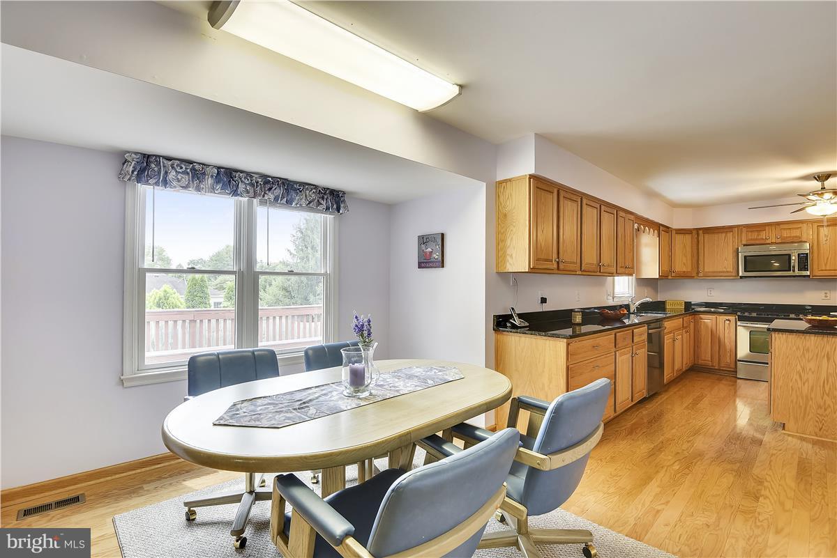 2313 Holly Spring Drive Silver Spring, MD 20905 - Photo 11 of 30 a kitchen with granite countertop a sink and appliances