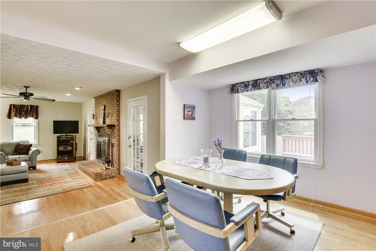2313 Holly Spring Drive Silver Spring, MD 20905 - Photo 12 of 30 a dining room with furniture and wooden floor