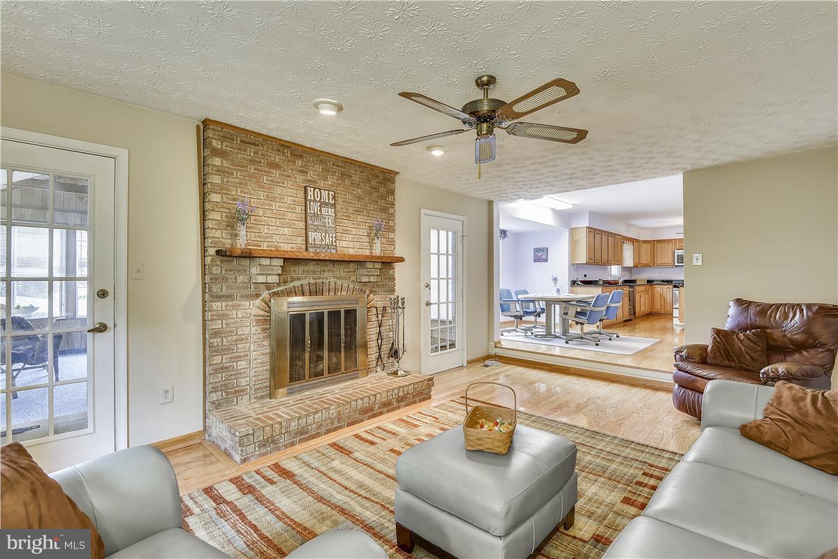 2313 Holly Spring Drive Silver Spring, MD 20905 - Photo 13 of 30 a living room with furniture and a fireplace