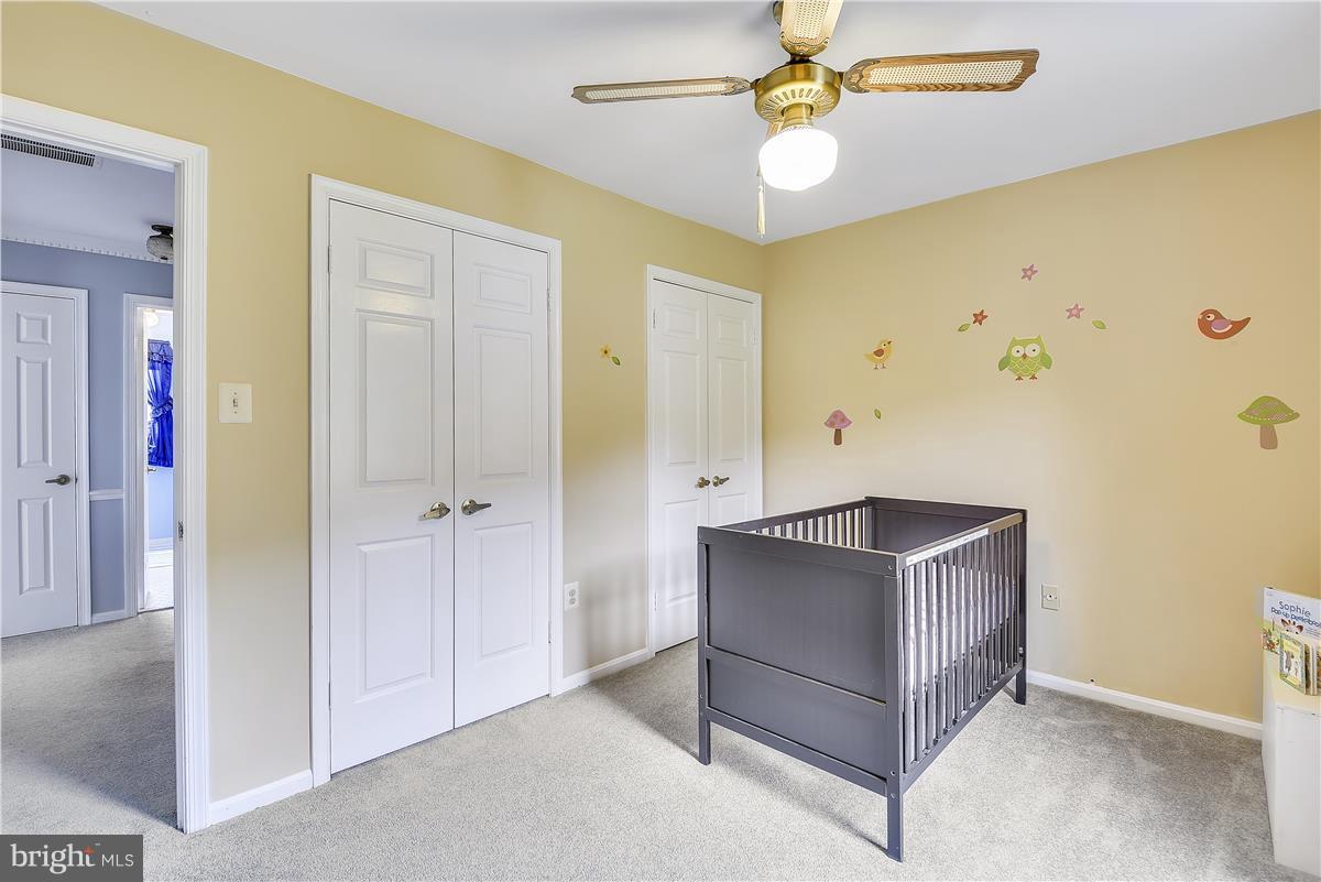 2313 Holly Spring Drive Silver Spring, MD 20905 - Photo 18 of 30 a view of a hallway with chandelier