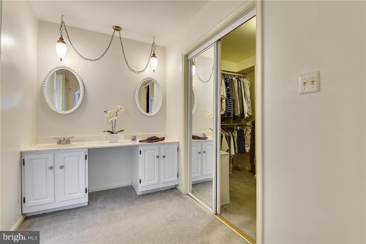 2313 Holly Spring Drive Silver Spring, MD 20905 - Photo 24 of 30 a bathroom with a double vanity sink mirror and bathtub