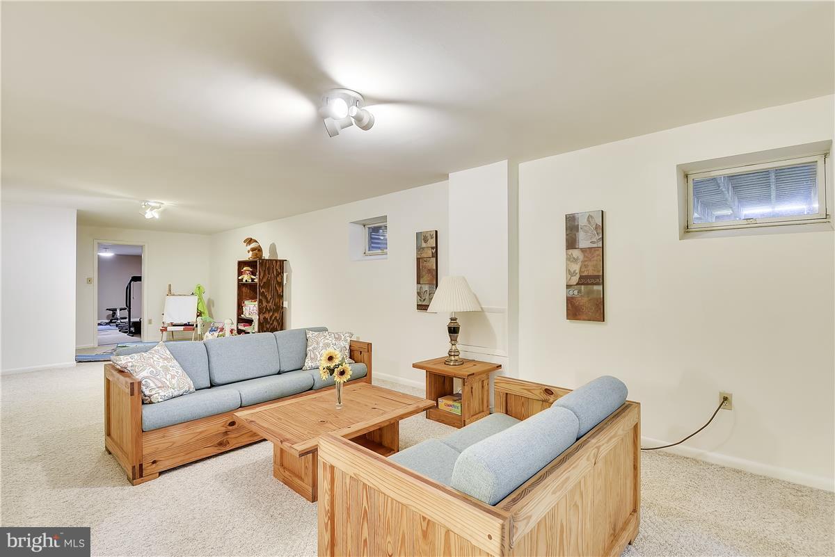 2313 Holly Spring Drive Silver Spring, MD 20905 - Photo 26 of 30 a living room with furniture and a table