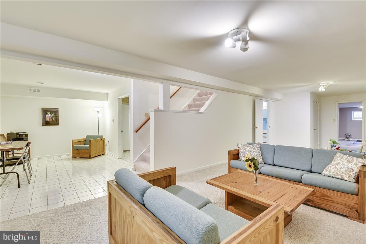 2313 Holly Spring Drive Silver Spring, MD 20905 - Photo 28 of 30 a living room with furniture and a wooden floor