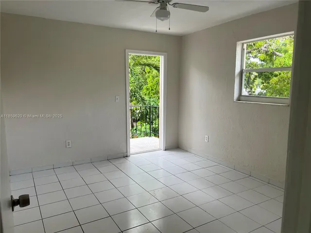 a view of an empty room and window