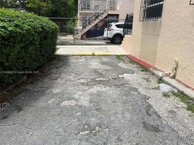 a view of roof deck with wooden floor and outdoor seating