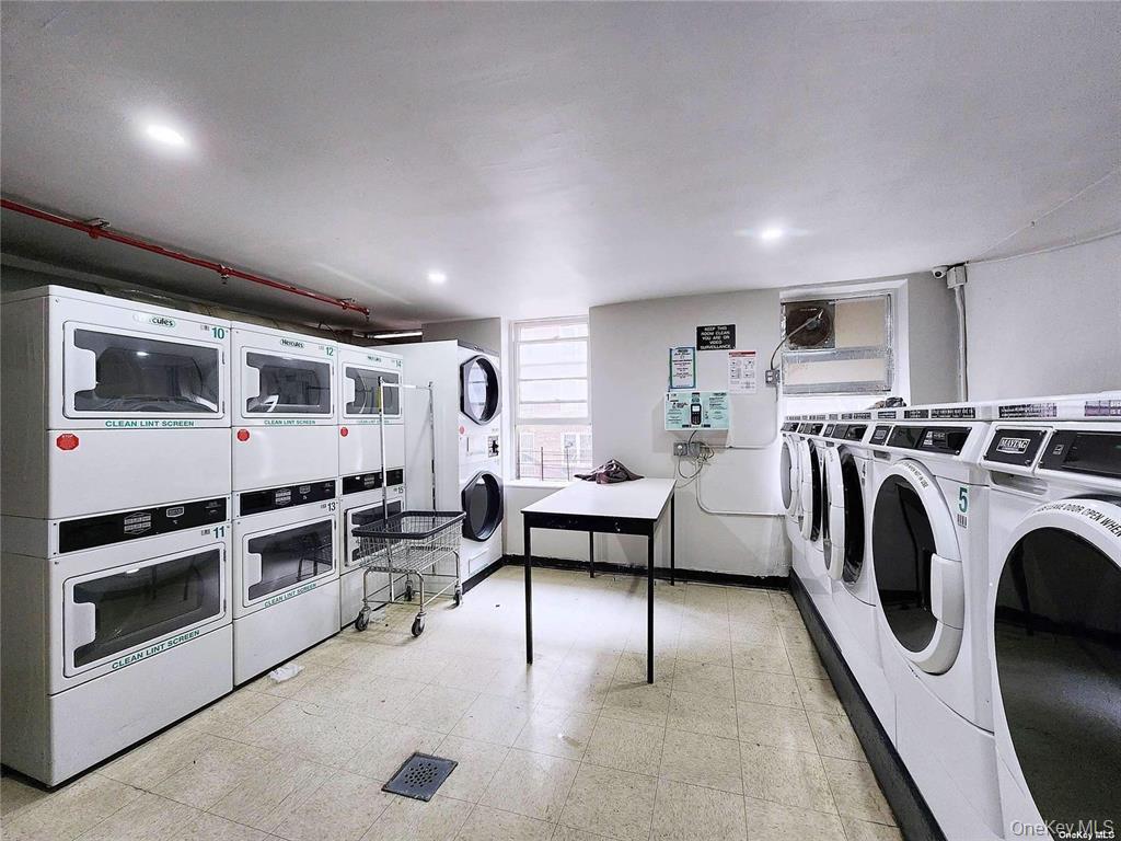 86-05 60th Road, Unit 3F Queens, NY 11373 - Photo 10 of 10 a living room with furniture a large window and a fireplace
