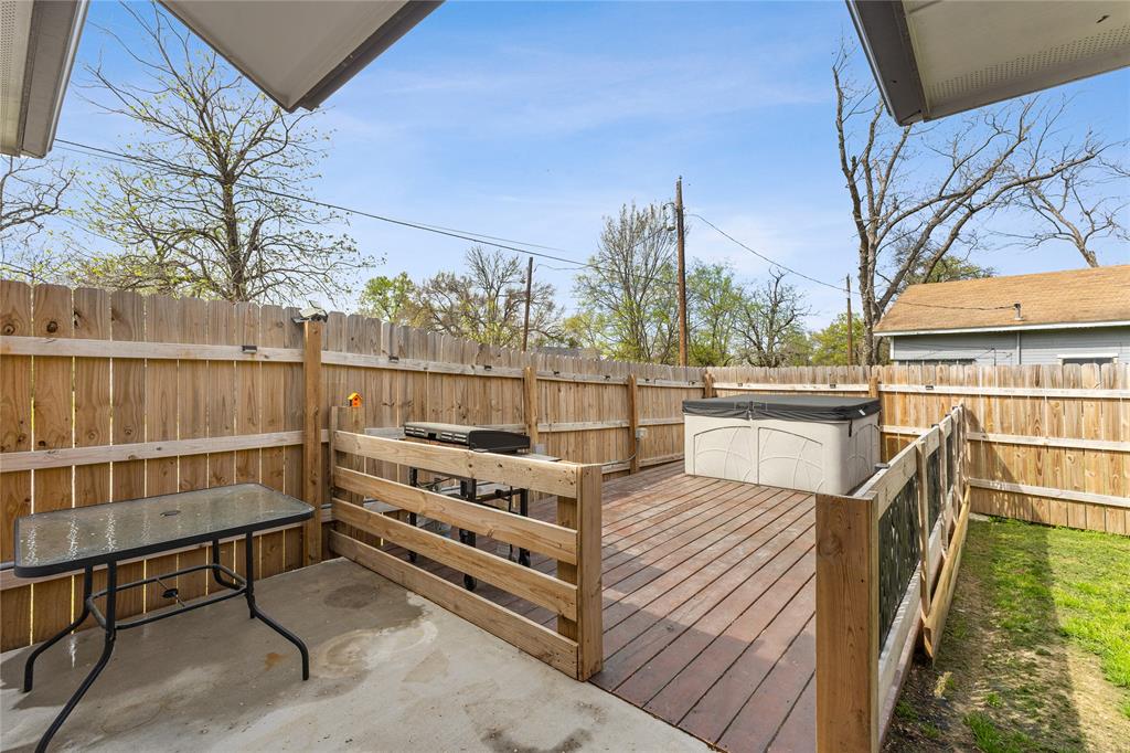 101 Ross Street Sulphur Springs, TX 75482 - Photo 23 of 30 Wooden deck with a fenced backyard