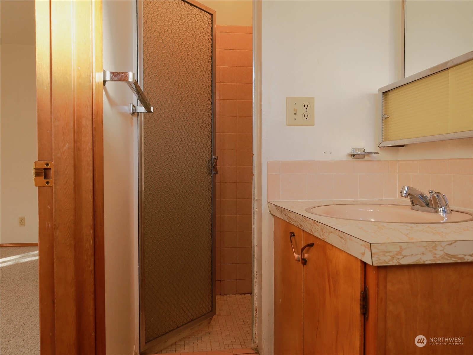 5150 South Creston Street Seattle, WA 98178 - Photo 12 of 27 a bathroom with a sink and a mirror