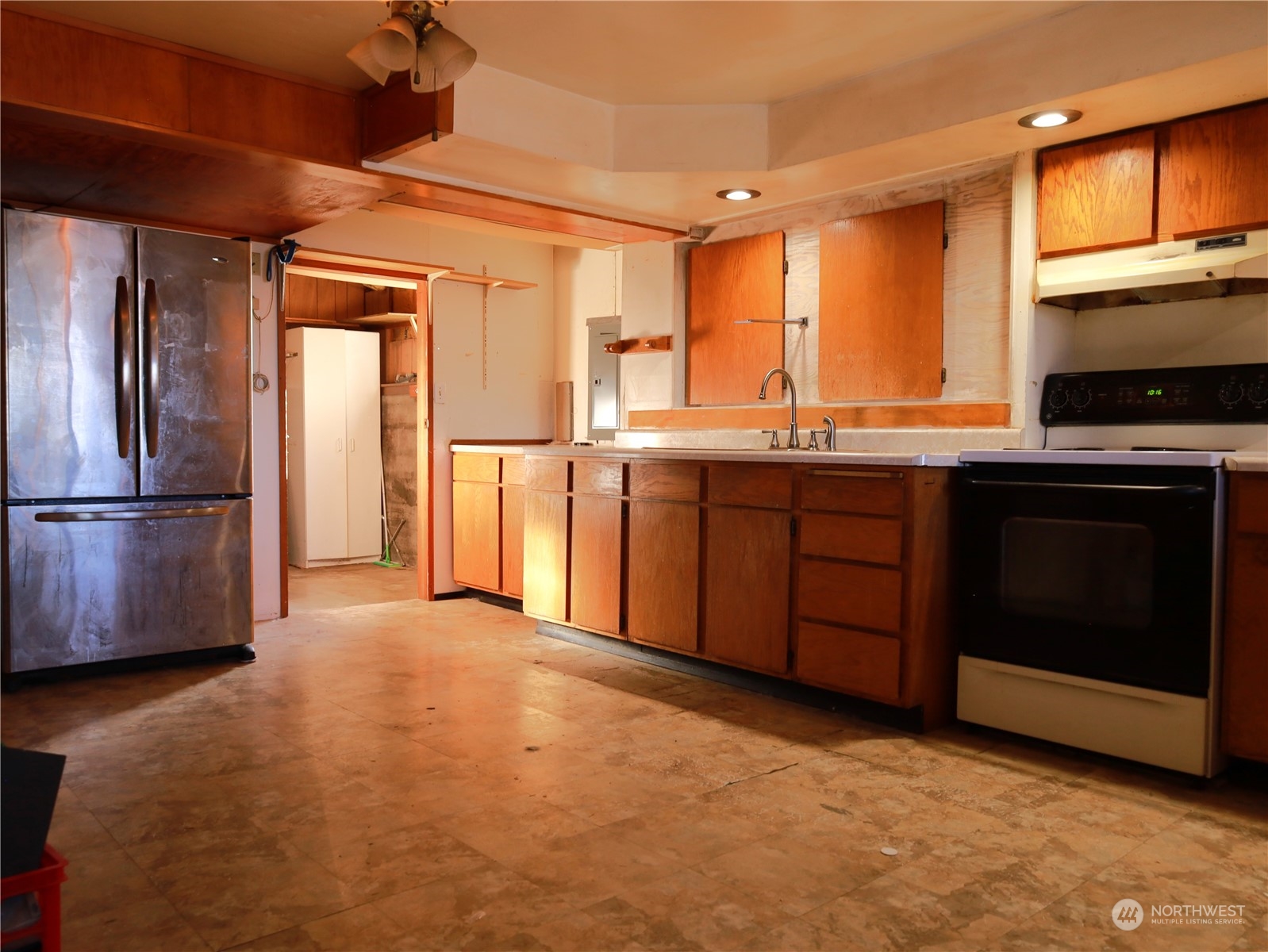 5150 South Creston Street Seattle, WA 98178 - Photo 24 of 27 a kitchen with stainless steel appliances granite countertop a refrigerator a sink and dishwasher