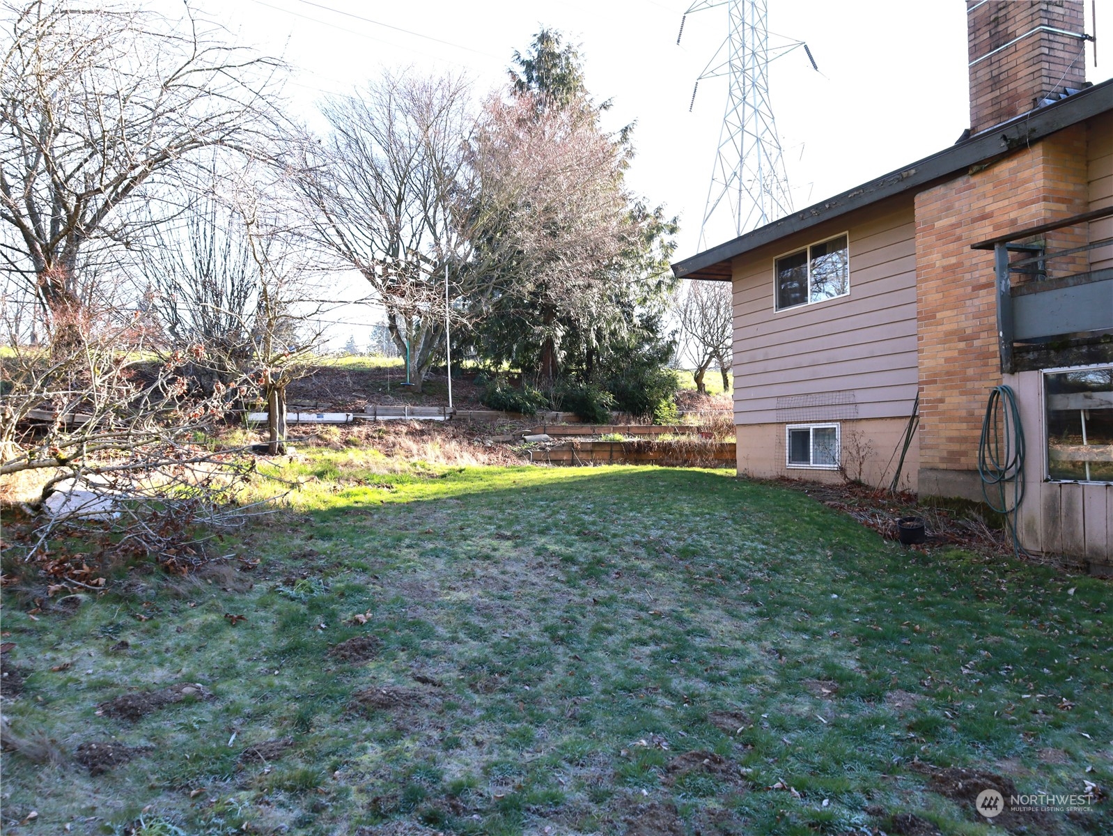 5150 South Creston Street Seattle, WA 98178 - Photo 26 of 27 a view of a house with backyard and sitting area
