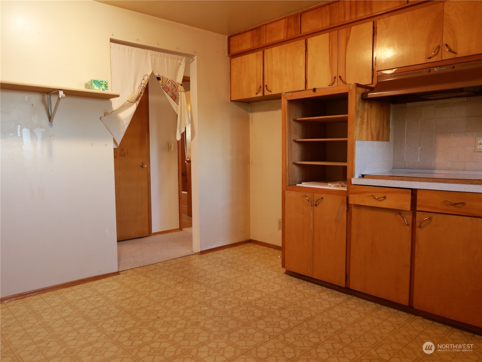 5150 South Creston Street Seattle, WA 98178 - Photo 4 of 27 a view of walk in closet with empty racks