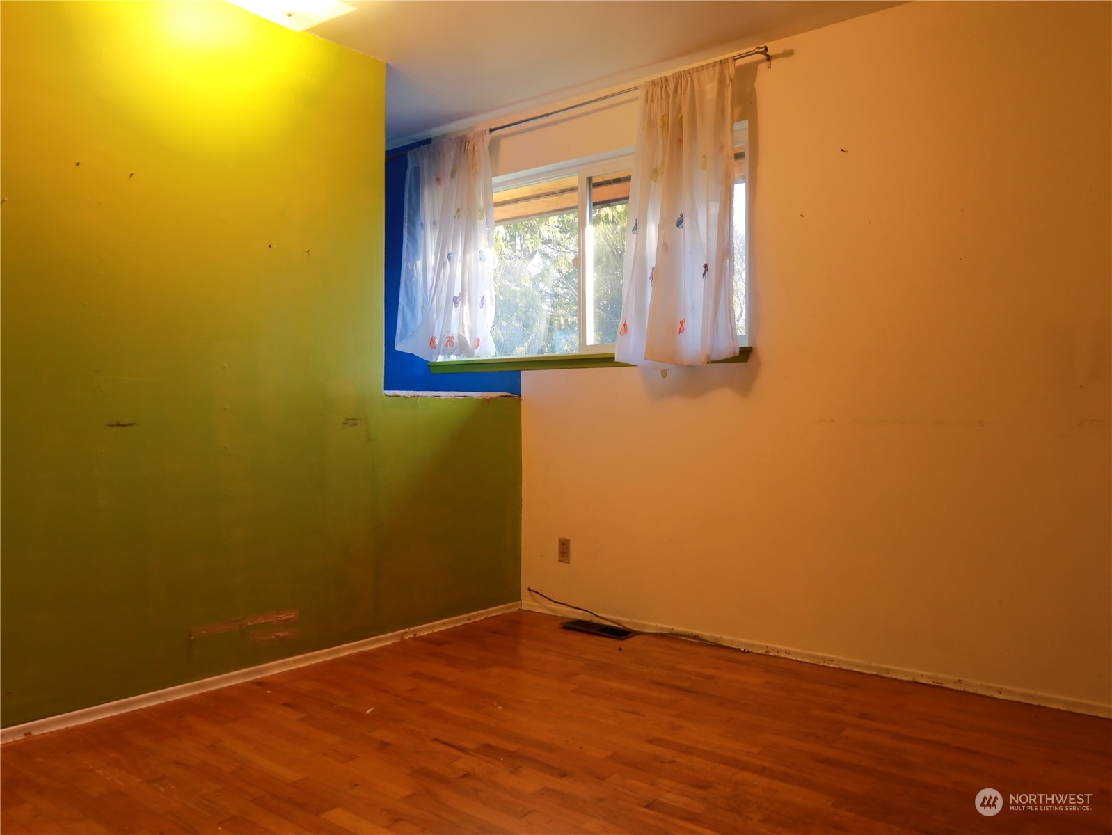 5150 South Creston Street Seattle, WA 98178 - Photo 7 of 27 a view of a small space with wooden floor and a window