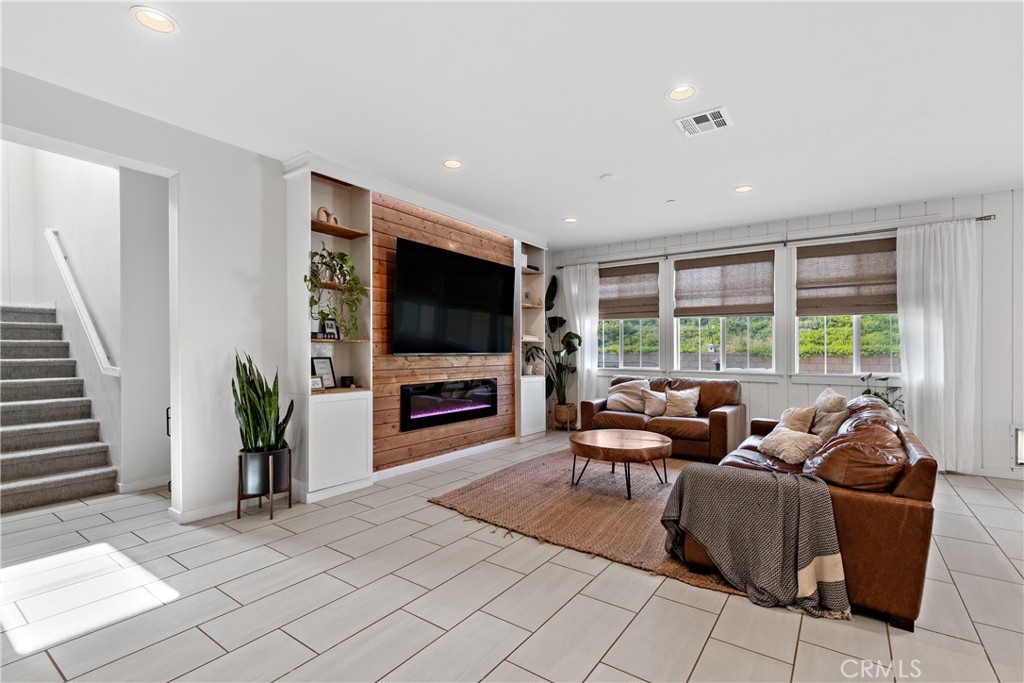28341 Heather Grn Way Menifee, CA 92584 - Photo 5 of 44 Spacious living room with upgraded entertainment center and fireplace