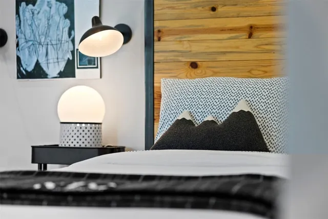 a bedroom with furniture and a wooden floor