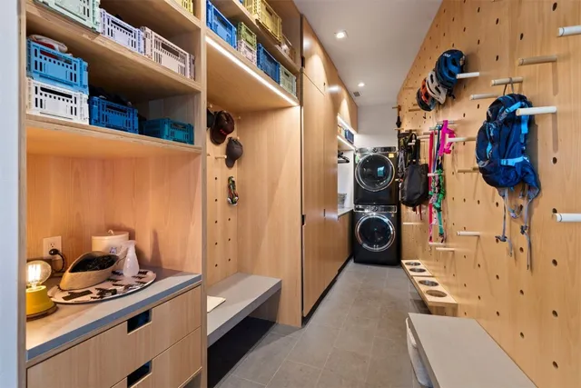a view of a livingroom with car garage and a ceiling fan