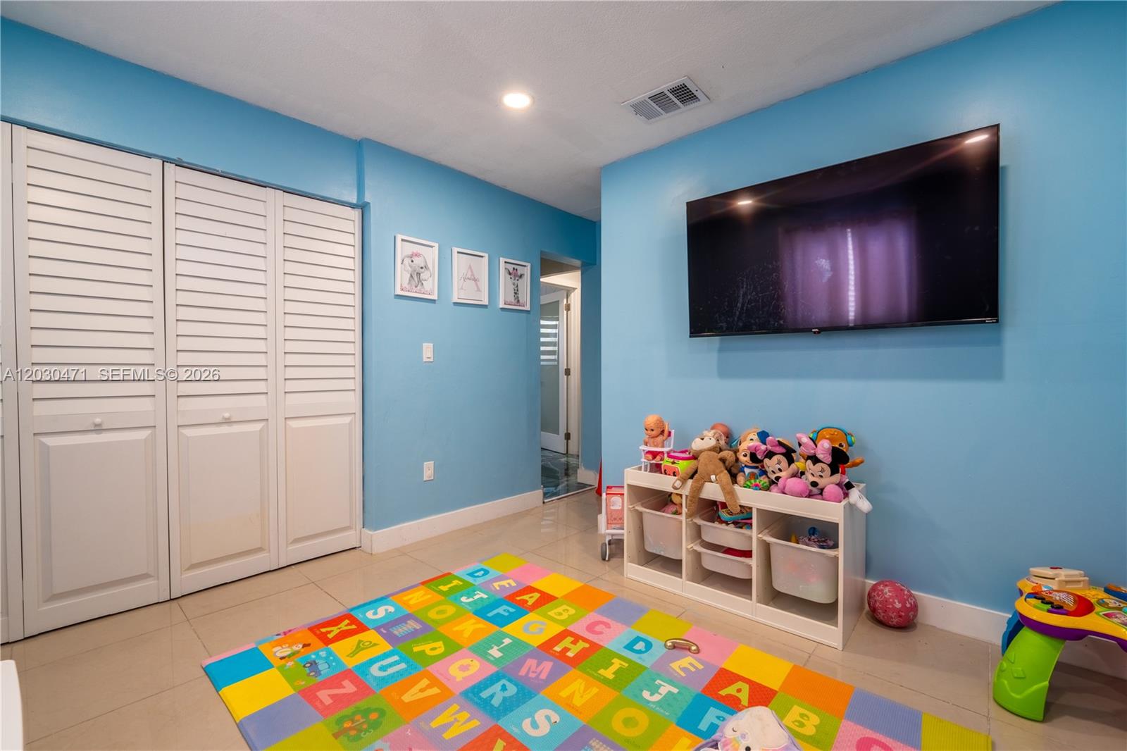 11851 Southwest 181st Street Miami, FL 33177 - Photo 5 of 25 a living room with furniture and a flat screen tv