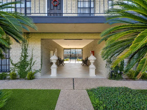a view of potted plants in front of house