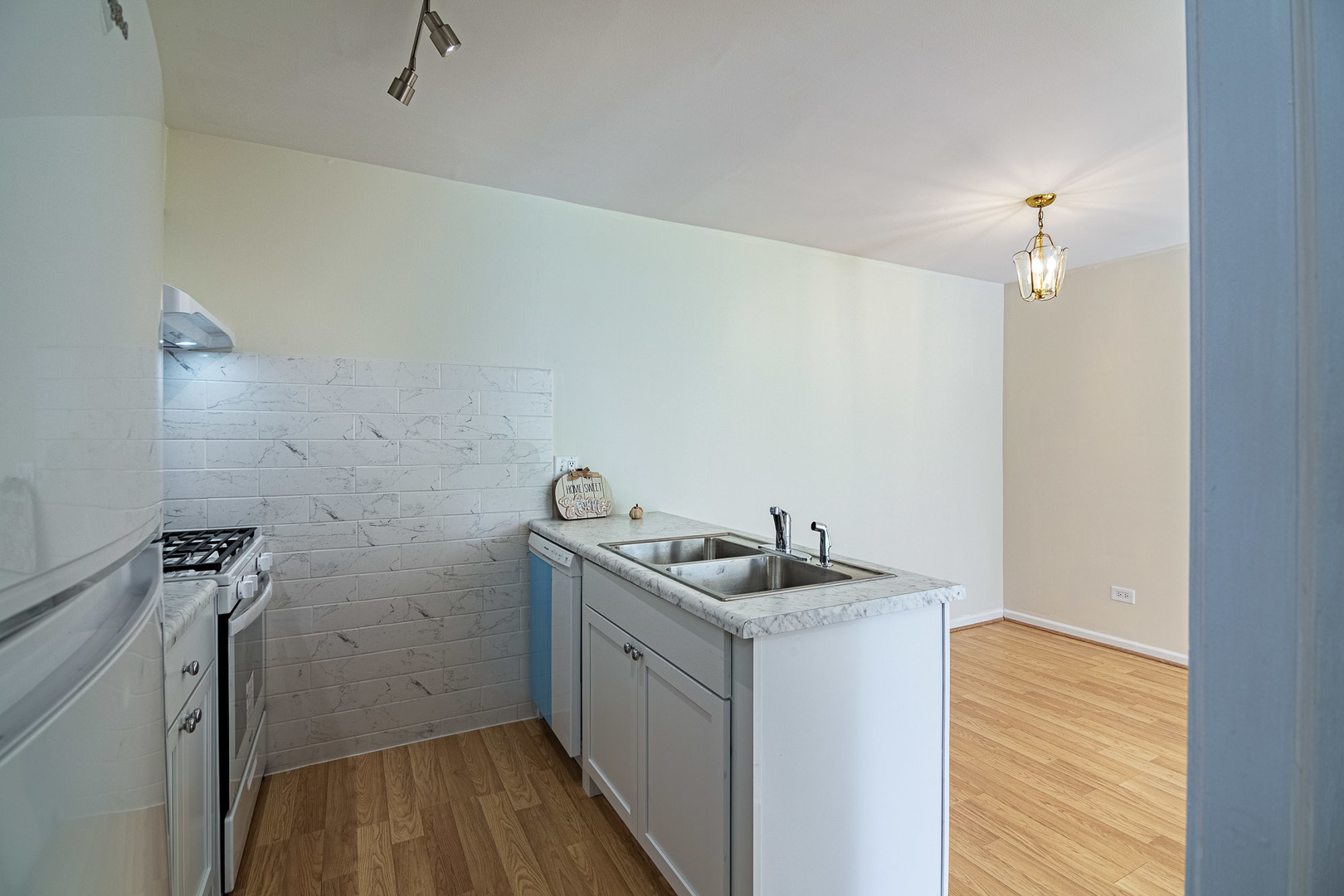 1279 Longacre Lane, Unit 1279 Wheeling, IL 60090 - Photo 5 of 14 a utility room with a sink dryer and washer