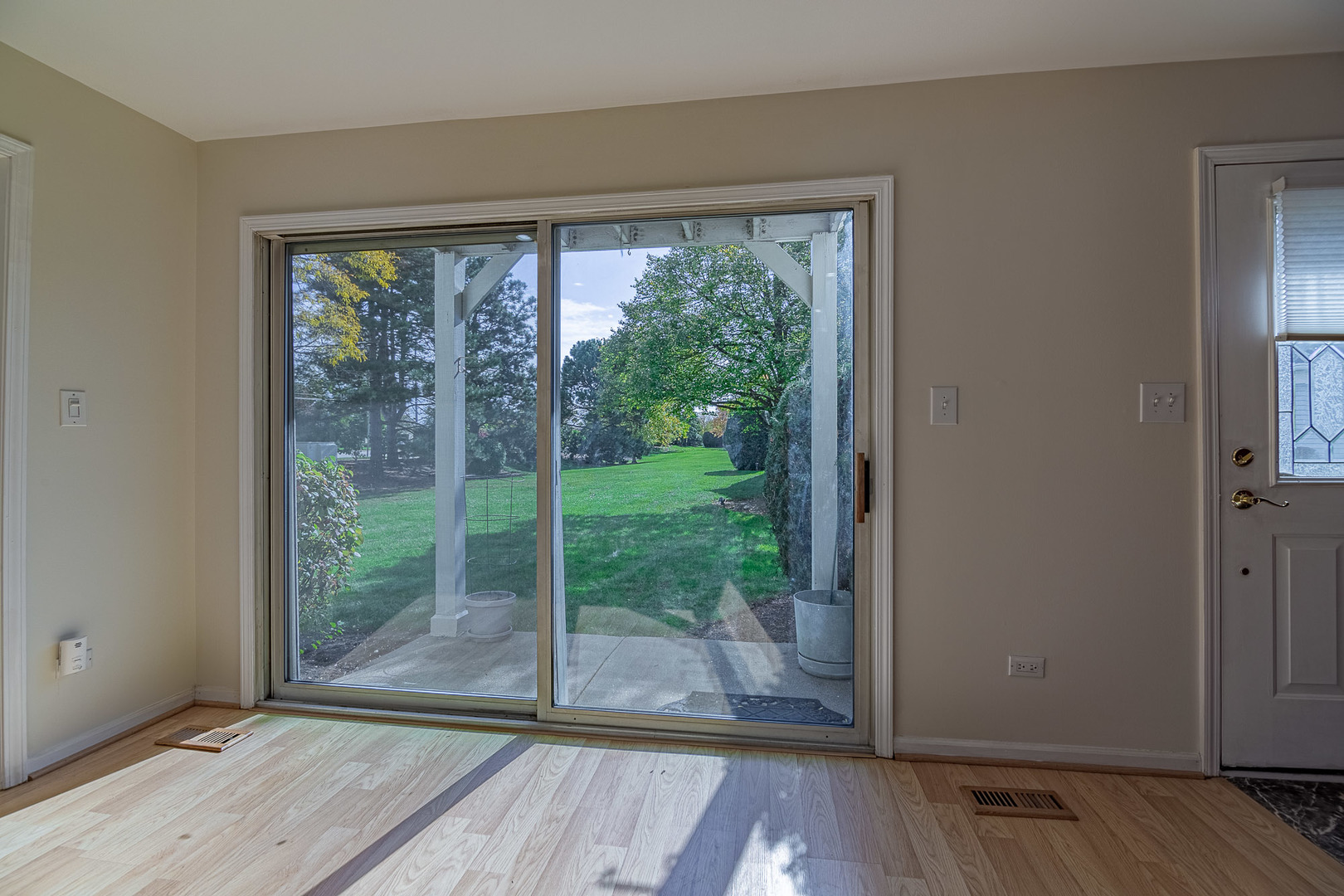 1279 Longacre Lane, Unit 1279 Wheeling, IL 60090 - Photo 7 of 14 a view of a room that has a large window