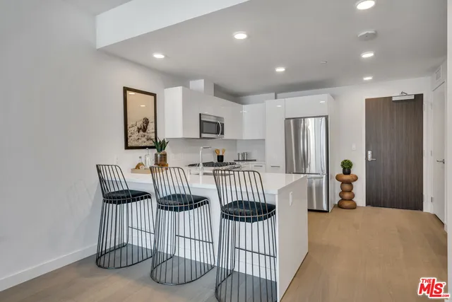 a view of kitchen with furniture and window