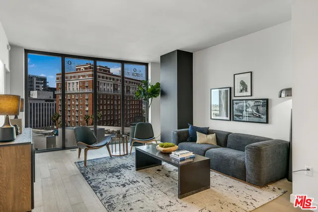 a living room with furniture lamp and rug