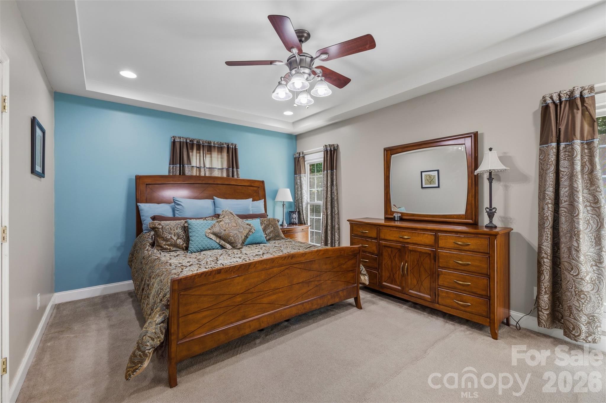 710 Sleepy Hollow Road Midland, NC 28107 - Photo 13 of 29 a bedroom with a bed and a chandelier