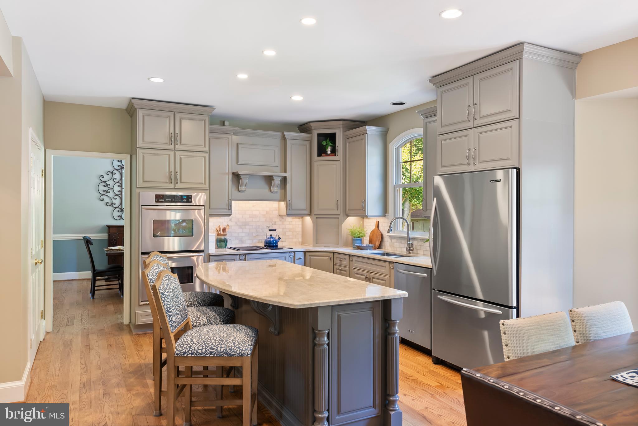 1600 Old Mill Bottom Run Annapolis, MD 21409 - Photo 14 of 56 a kitchen with refrigerator a table and chairs