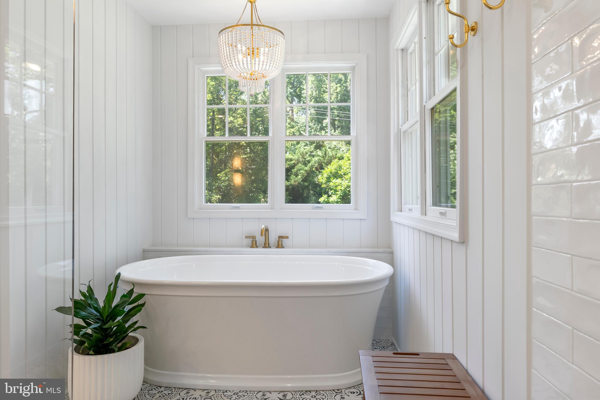 1600 Old Mill Bottom Run Annapolis, MD 21409 - Photo 26 of 56 a white bath tub sitting in a bathroom next to a window