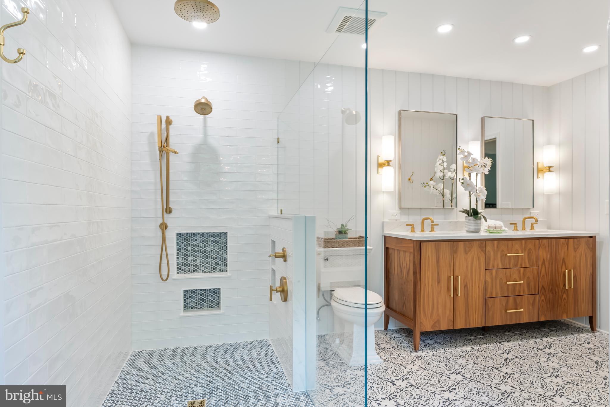 1600 Old Mill Bottom Run Annapolis, MD 21409 - Photo 27 of 56 a bathroom with a sink a mirror and a shower