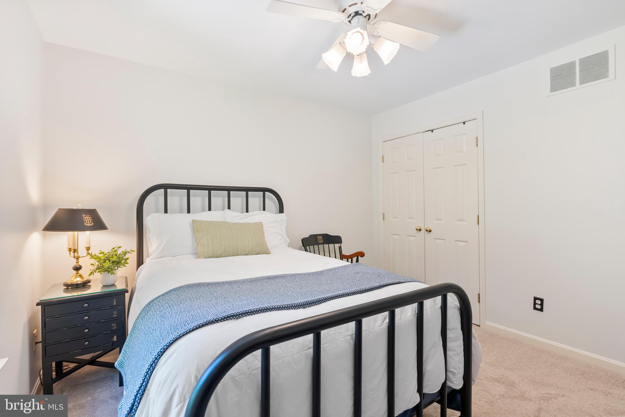 1600 Old Mill Bottom Run Annapolis, MD 21409 - Photo 30 of 56 a bedroom with a bed and a chandelier