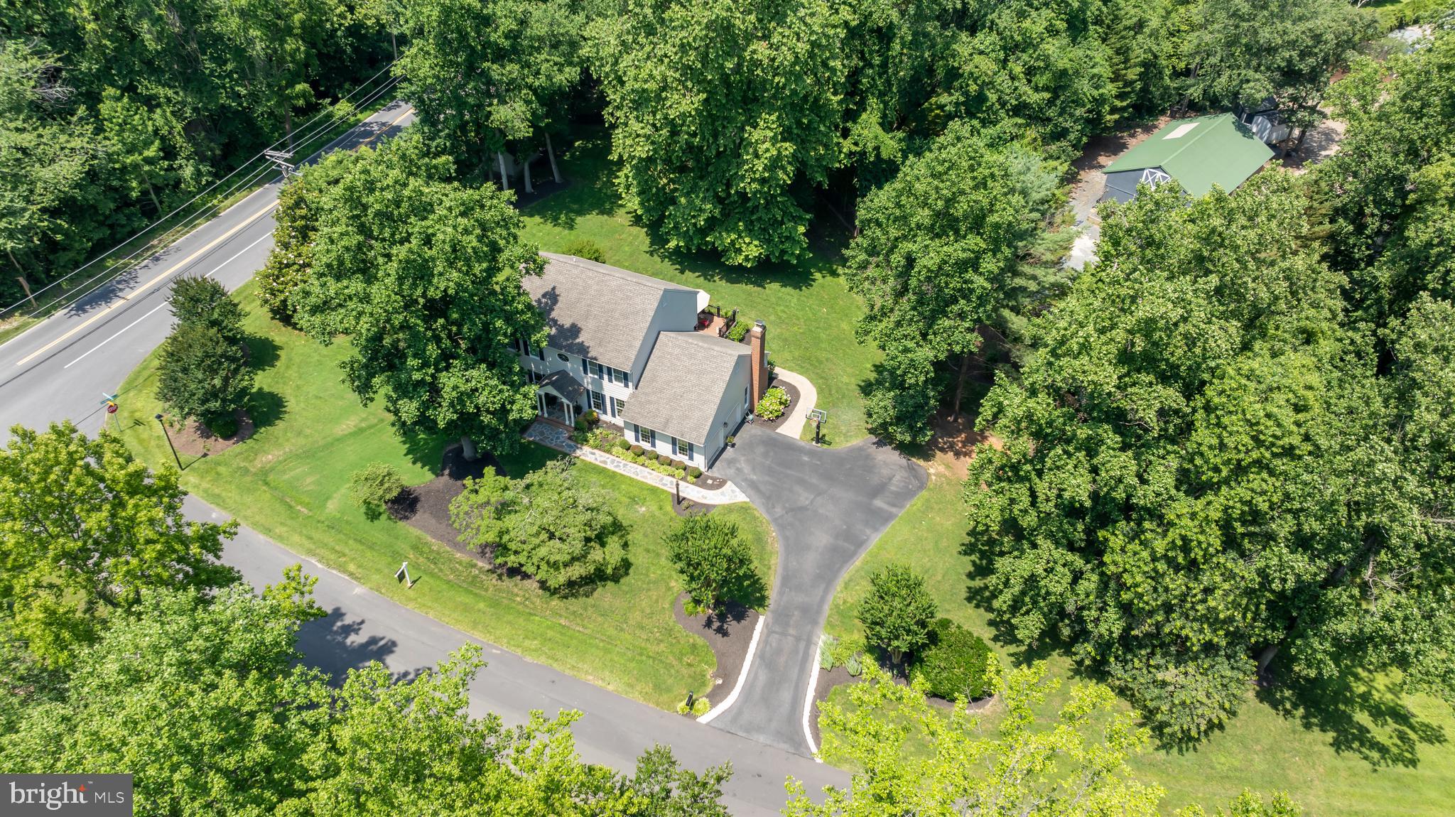 1600 Old Mill Bottom Run Annapolis, MD 21409 - Photo 50 of 56 an aerial view of a yard with plants and large trees