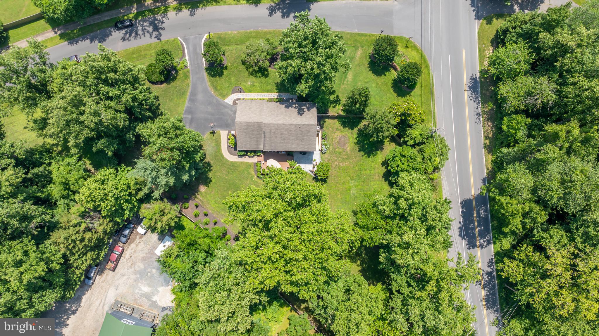 1600 Old Mill Bottom Run Annapolis, MD 21409 - Photo 51 of 56 an aerial view of a house with a yard and garden