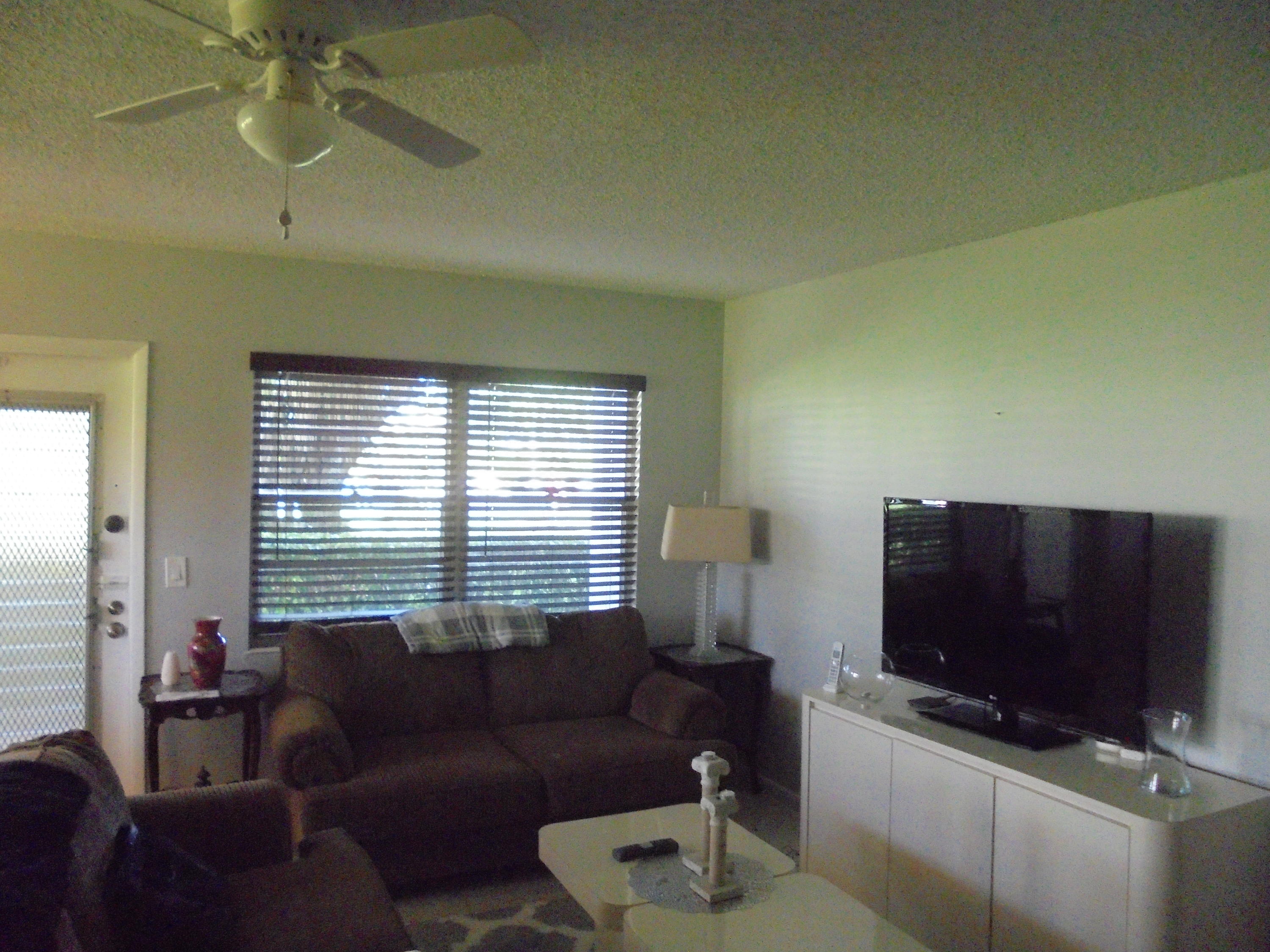 14 Brighton A Boca Raton, FL 33434 - Photo 6 of 15 a living room with furniture and a flat screen tv