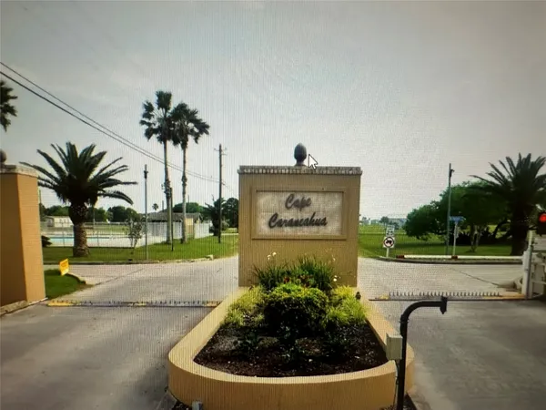 a view of a yard and an house in the background