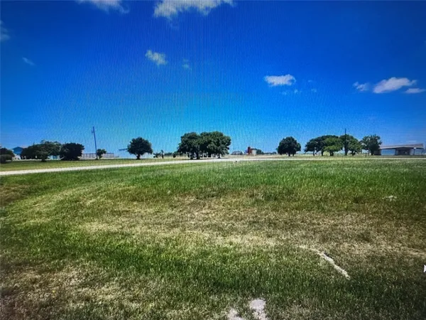 a view of a golf course with a big yard