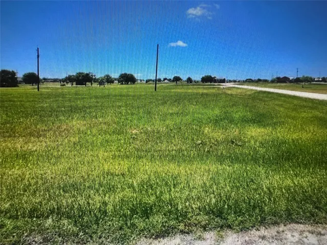 a view of a golf course with a big yard