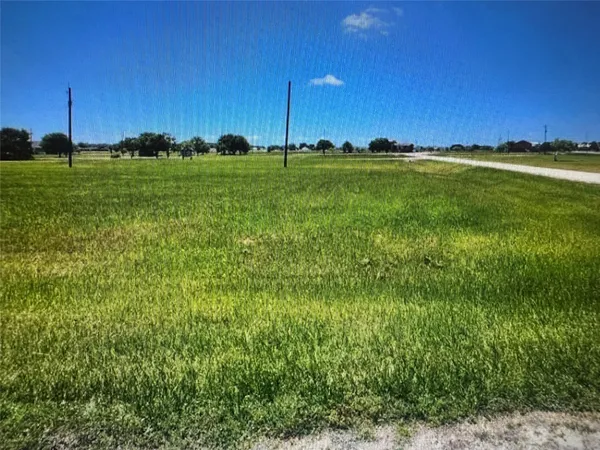 a view of a golf course with a big yard