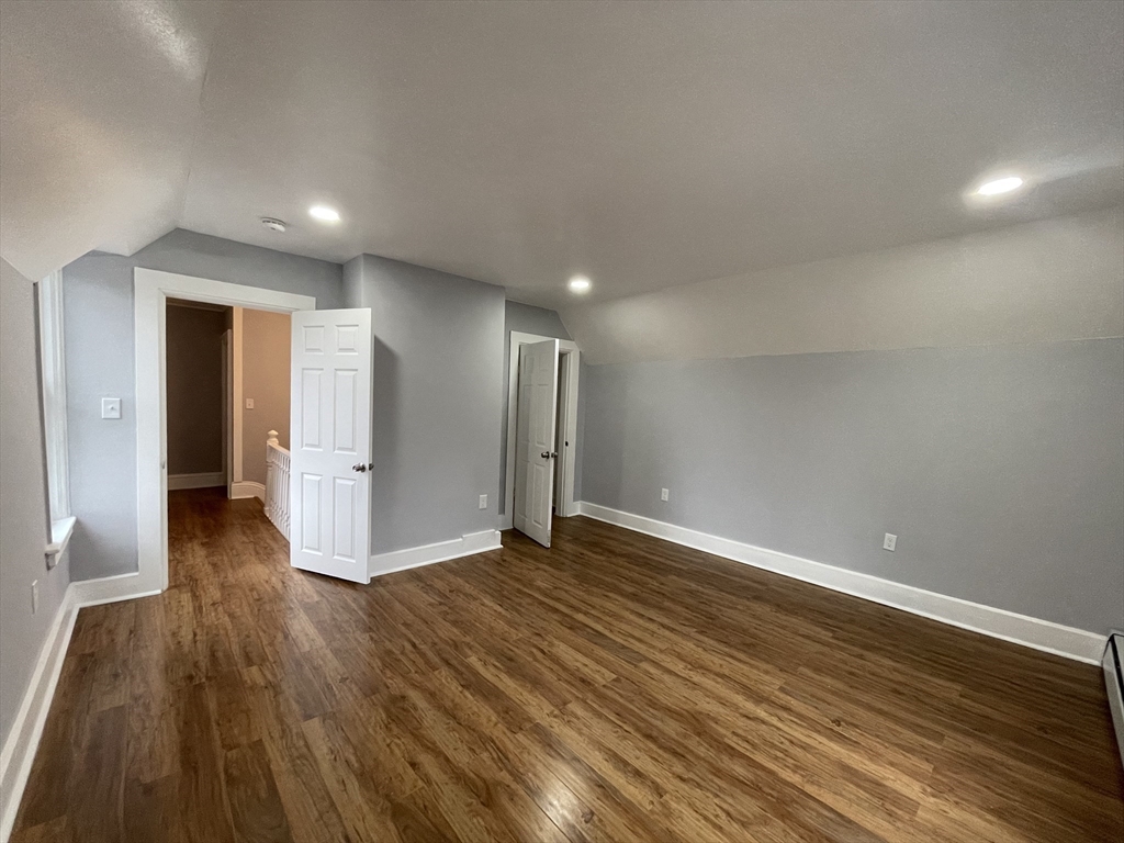 59 High Street Warren, MA 01083 - Photo 22 of 42 a view of an empty room with wooden floor