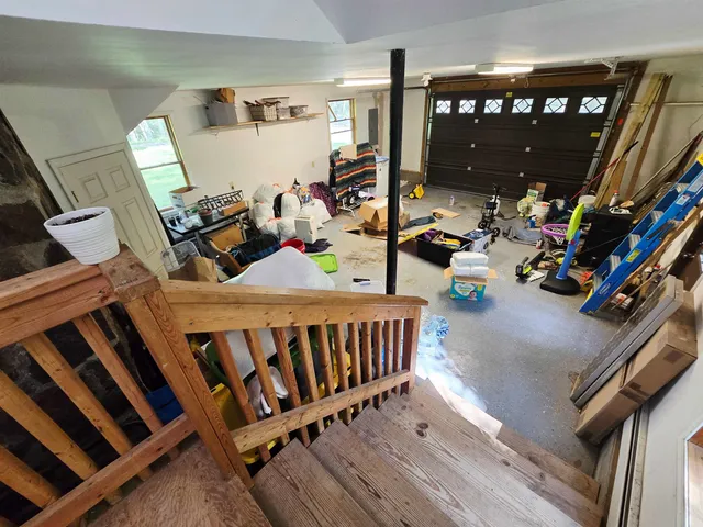 a bedroom with furniture and a wooden floor