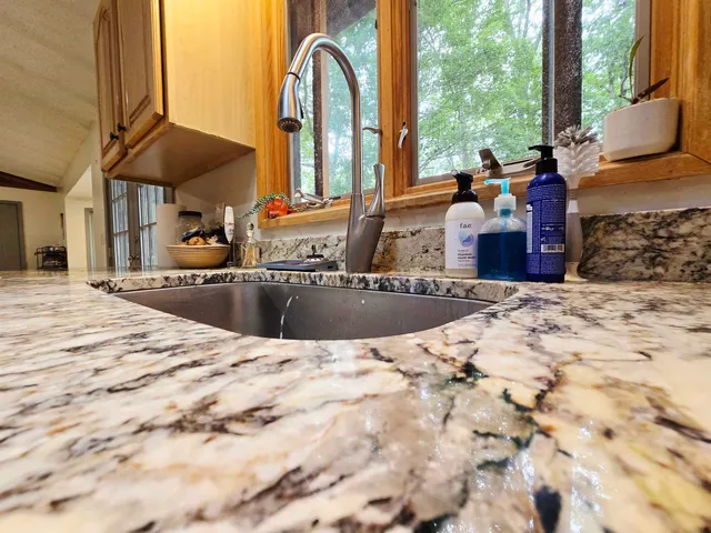 a view of a swimming pool with a patio