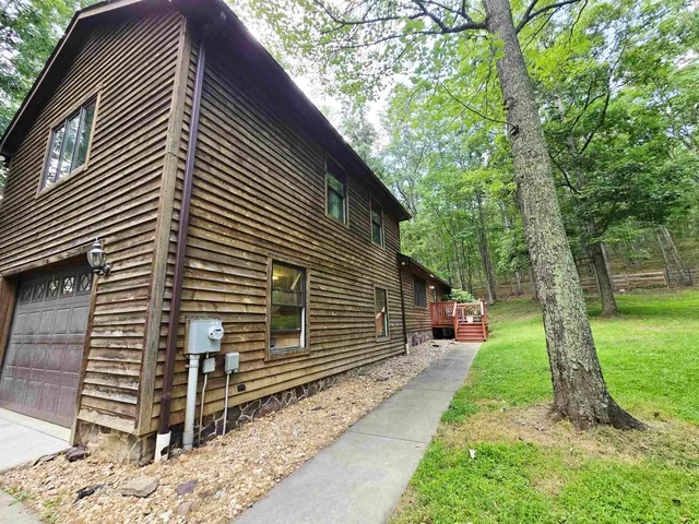 a backyard of a house with lots of green space