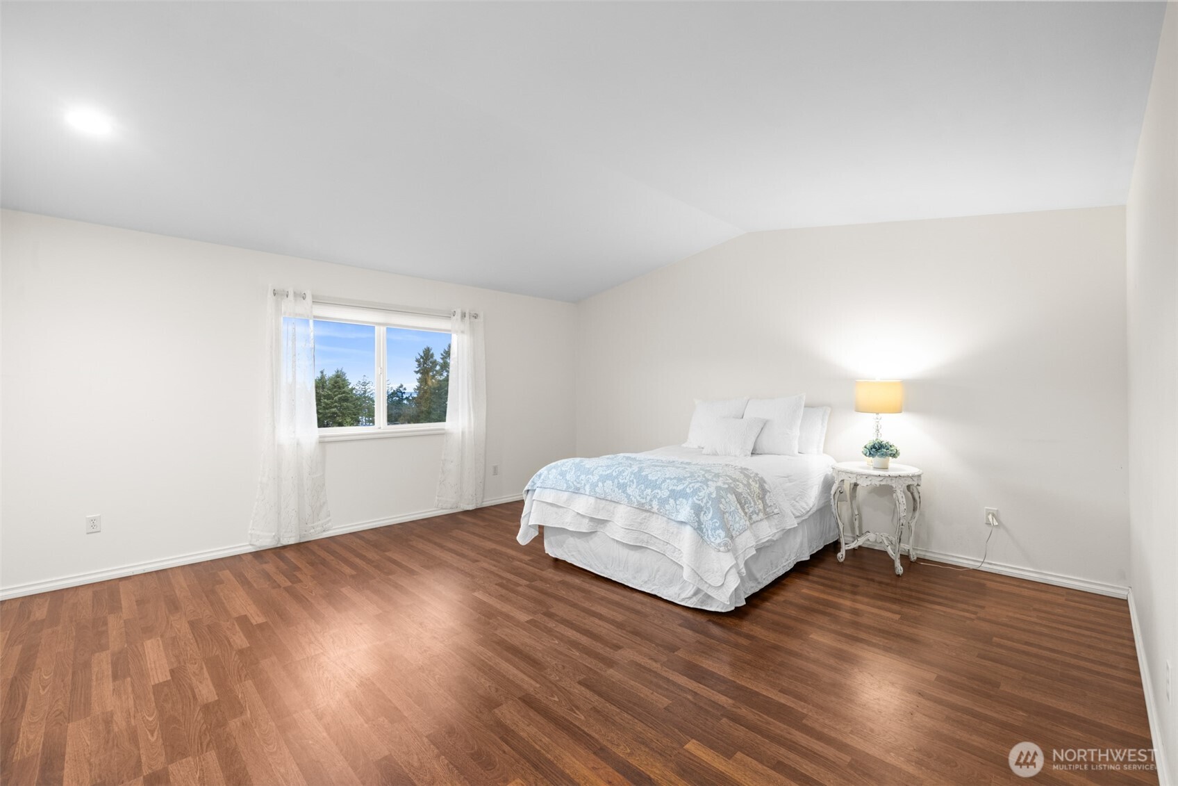 382 Discovery View Drive Sequim, WA 98382 - Photo 14 of 40 a bedroom with a bed and a window