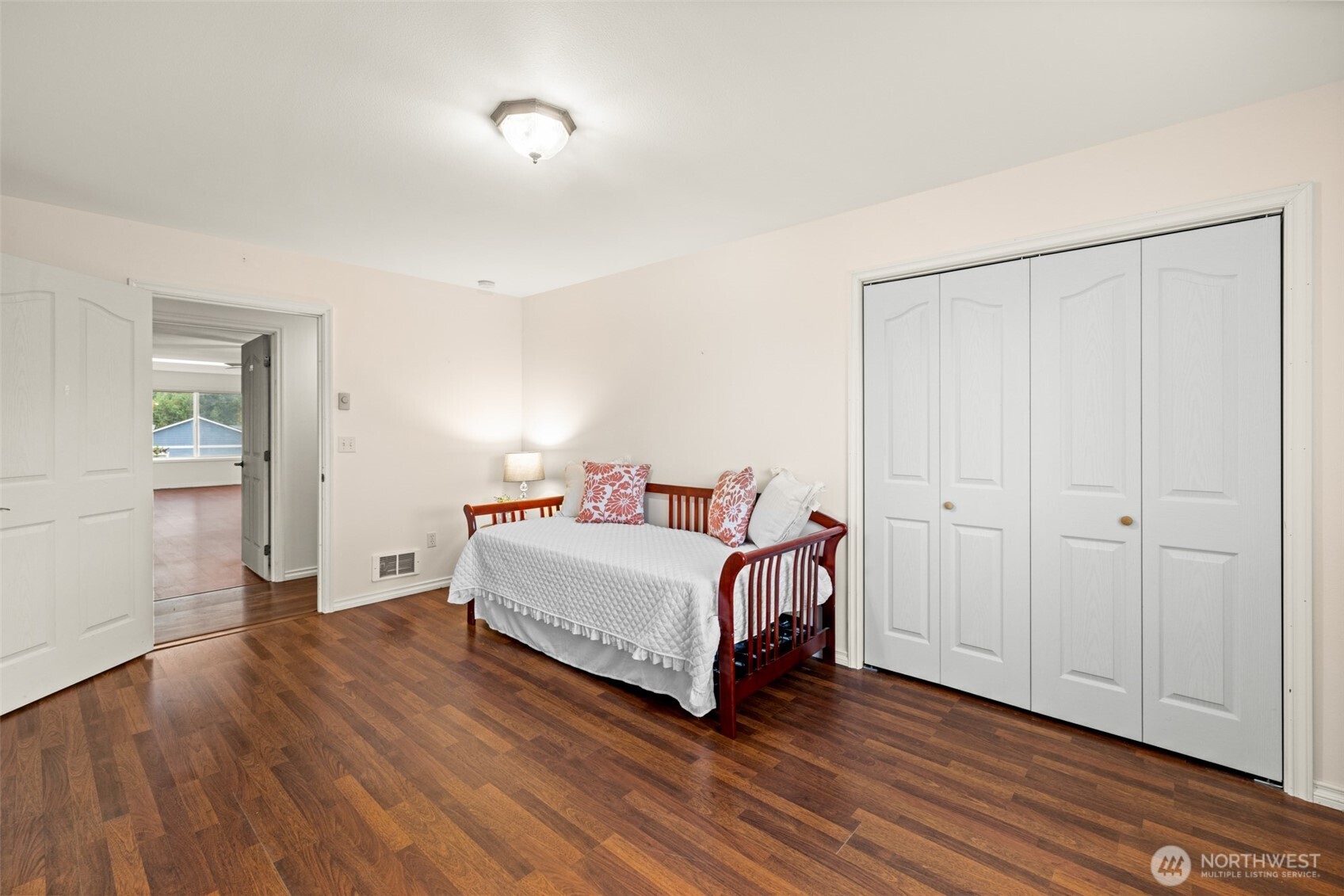 382 Discovery View Drive Sequim, WA 98382 - Photo 21 of 40 a view of a bedroom with bed and wooden floor
