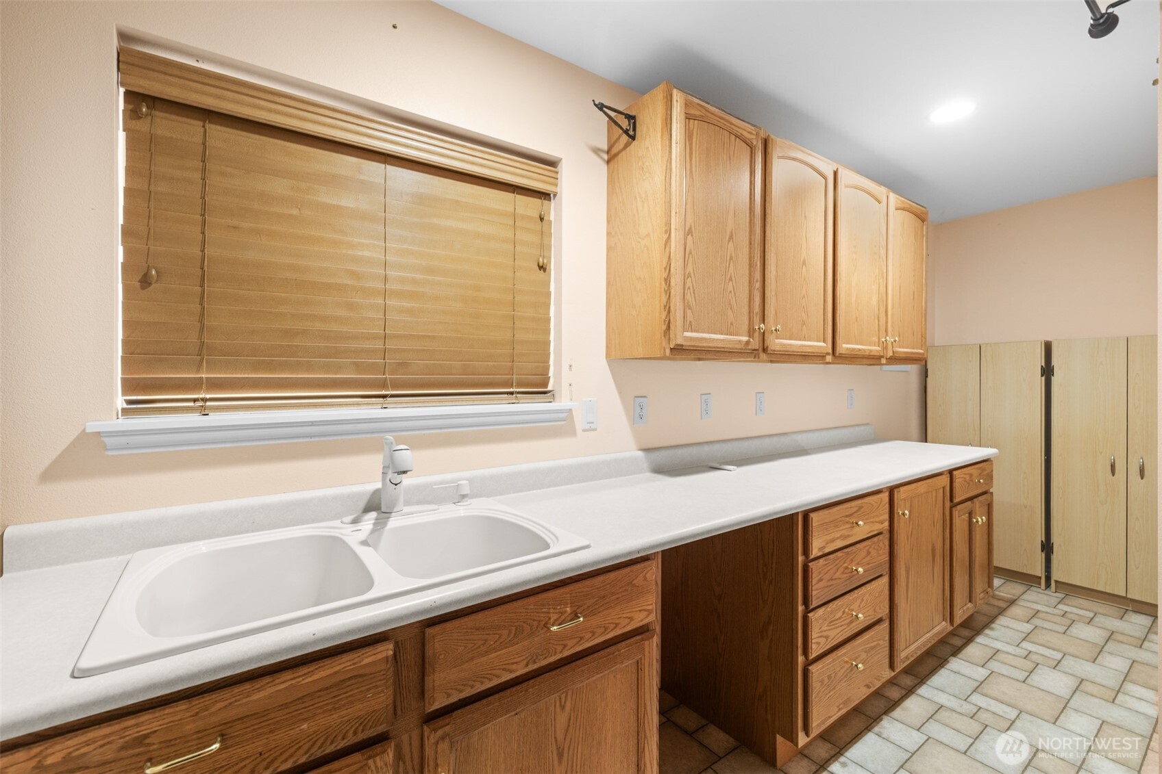 382 Discovery View Drive Sequim, WA 98382 - Photo 31 of 40 a kitchen with a sink and cabinets