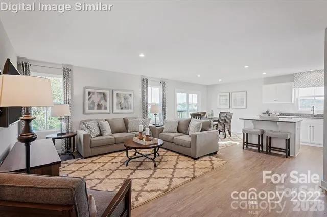 a living room with furniture and a table