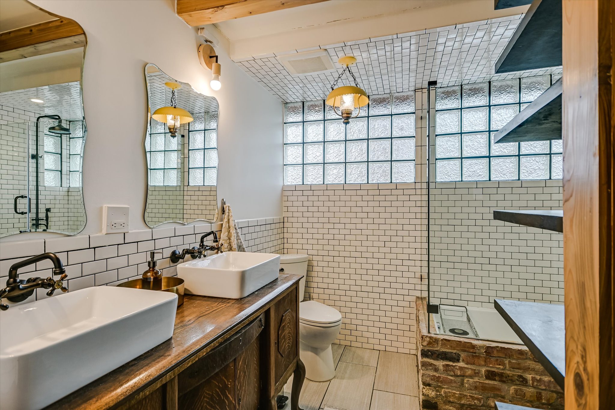 504 Powell Circle Austin, TX 78704 - Photo 9 of 23 a bathroom with a sink mirror vanity and toilet