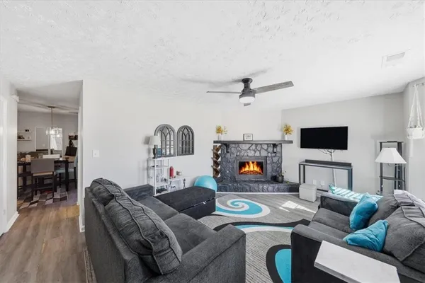a living room with furniture and a flat screen tv