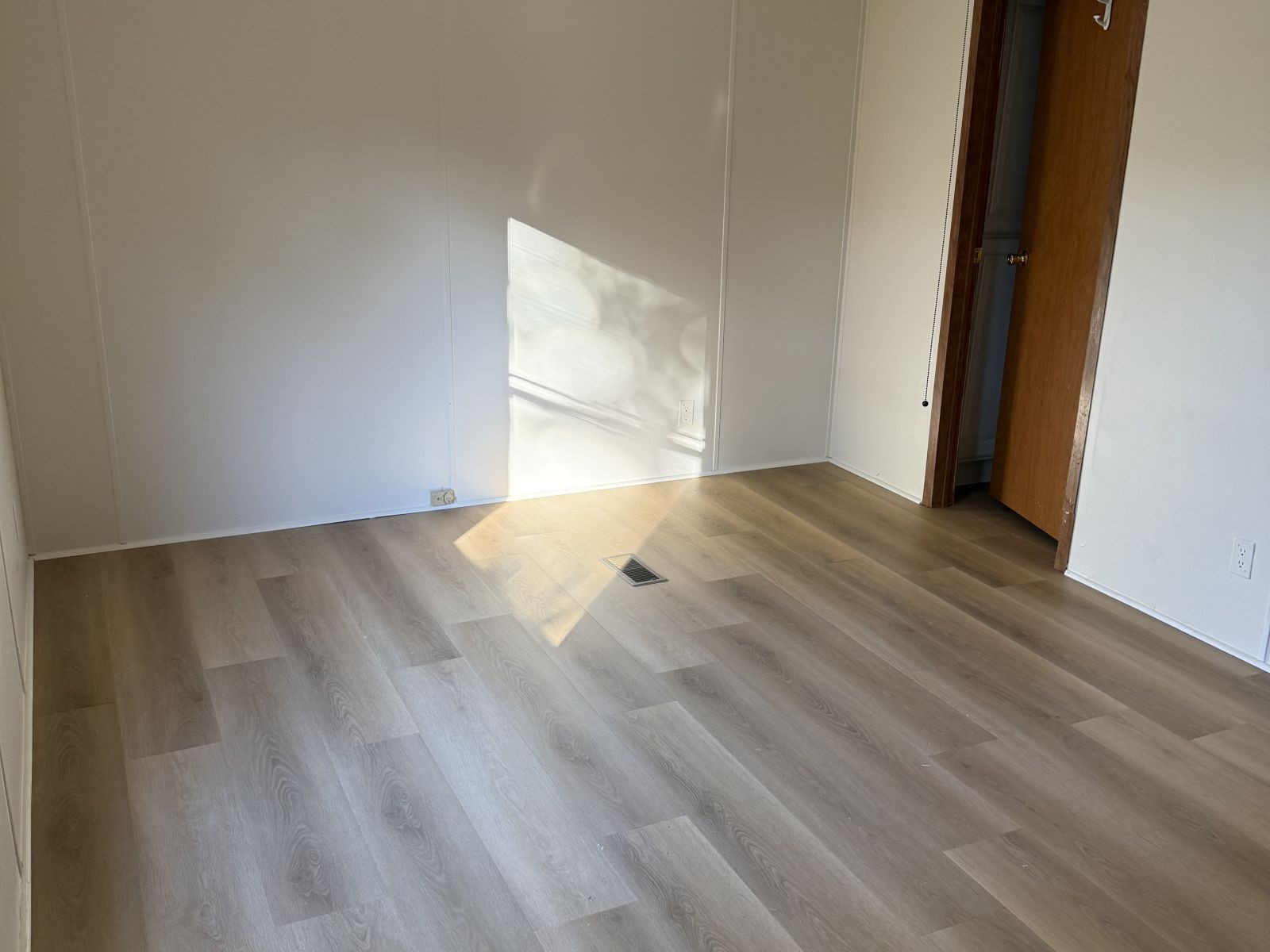 1600 Little Hurricane Creek Road McEwen, TN 37101 - Photo 4 of 9 a view of an empty room with wooden floor