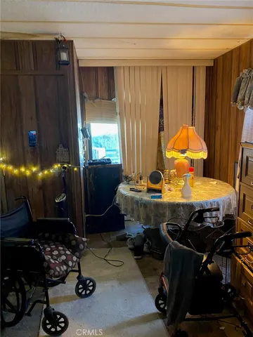 a room with furniture and musical instruments